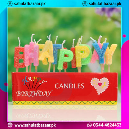Colorful birthday candles spelling 'HAPPY BIRTHDAY' in a red holder with a blurred green background.