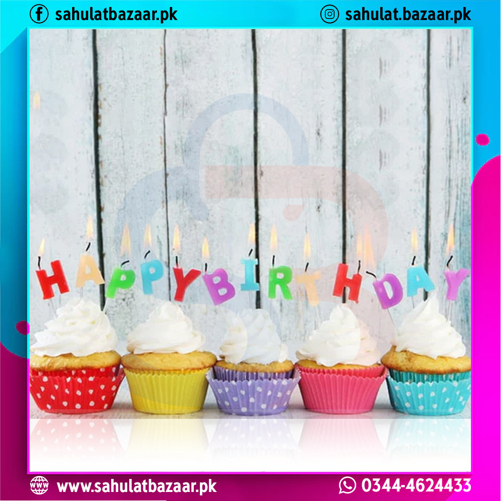 Cupcakes with colorful 'Happy Birthday' candles on a wooden background