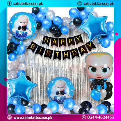 Birthday party setup with balloons, a 'Happy Birthday' banner, and a toy figure on a colorful background.