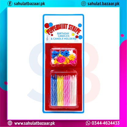 Packaged birthday candles and holders with colorful design on a white background