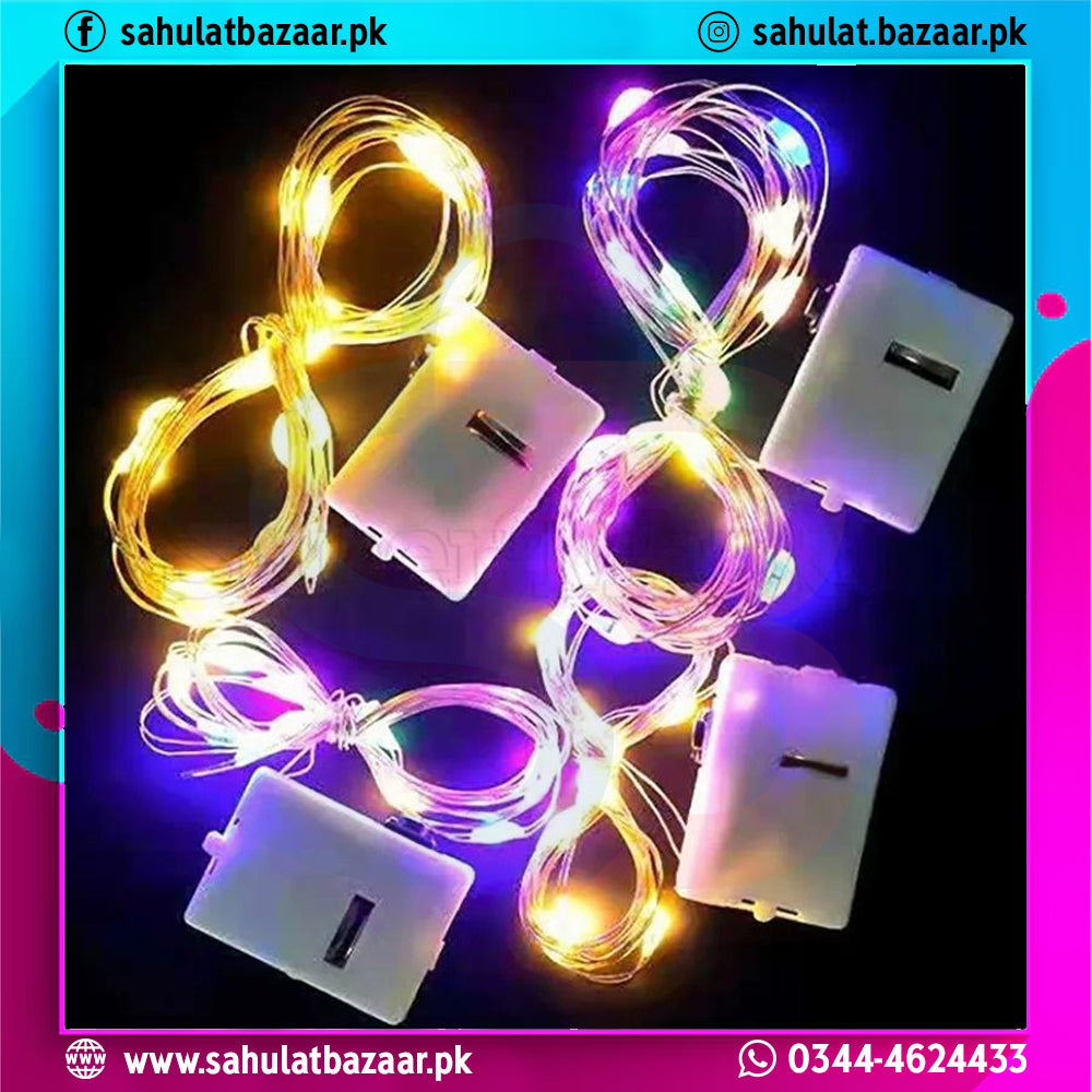 String lights with battery packs on a colorful background