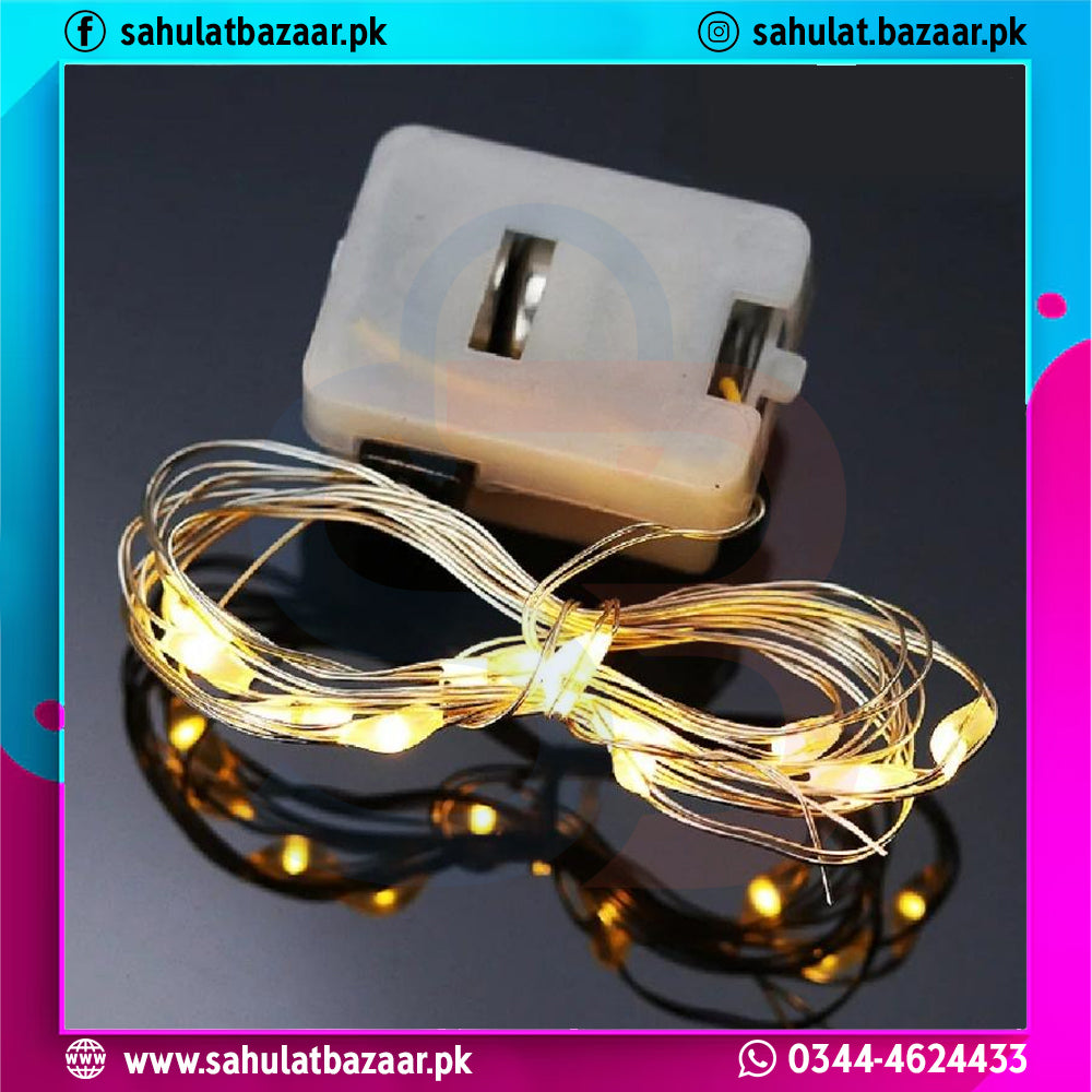 String lights with a clip and packaging on a reflective surface, branded 'sahulatbazaar.pk'.