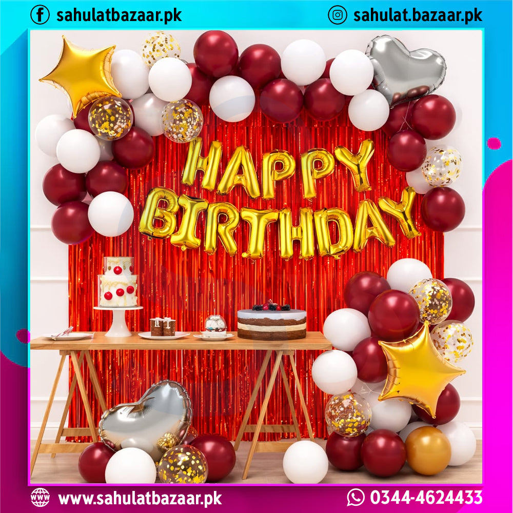 Birthday celebration setup with balloons, cake, and 'Happy Birthday' banner.