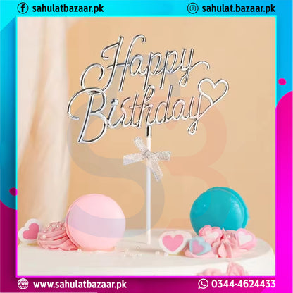 Happy Birthday cake topper with colorful candies on a cake against a light background