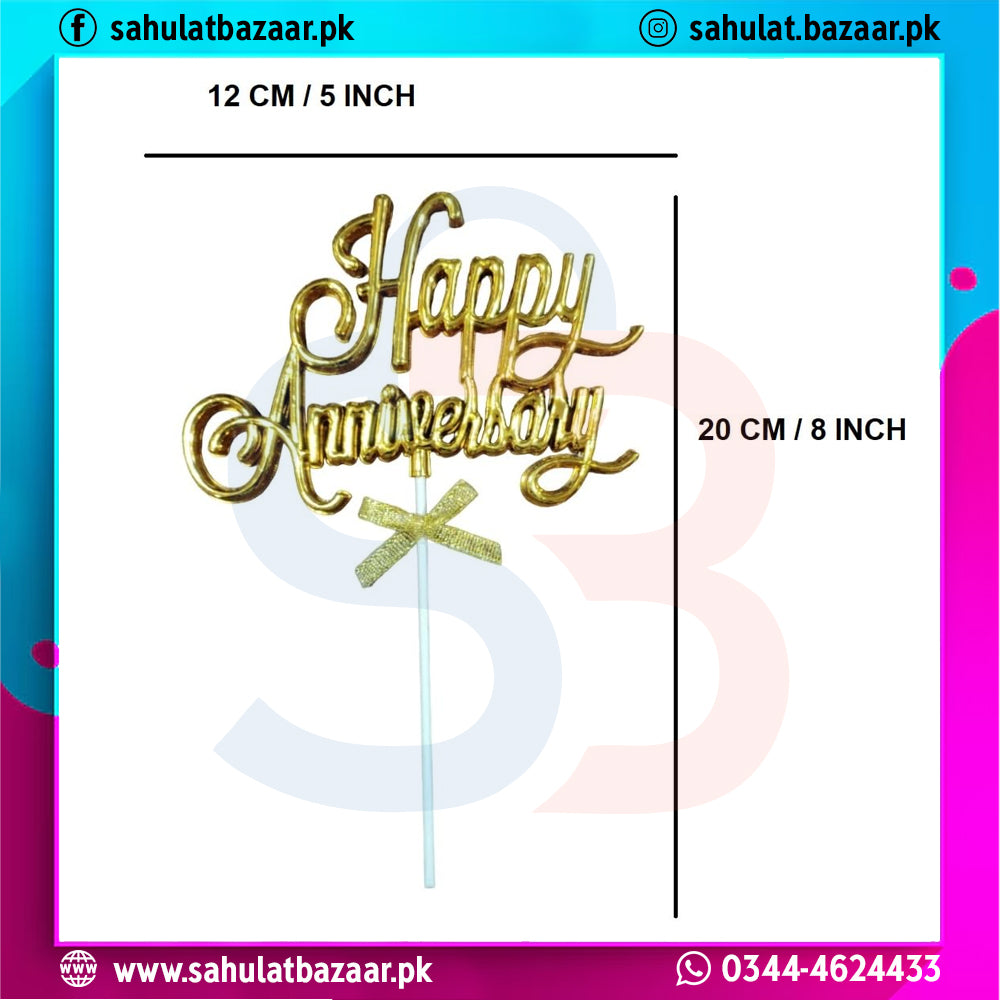 Gold 'Happy Anniversary' cake topper with measurements on a colorful background