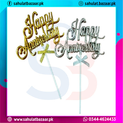 Two 'Happy Anniversary' cake toppers on sticks with gold and silver text against a white background.