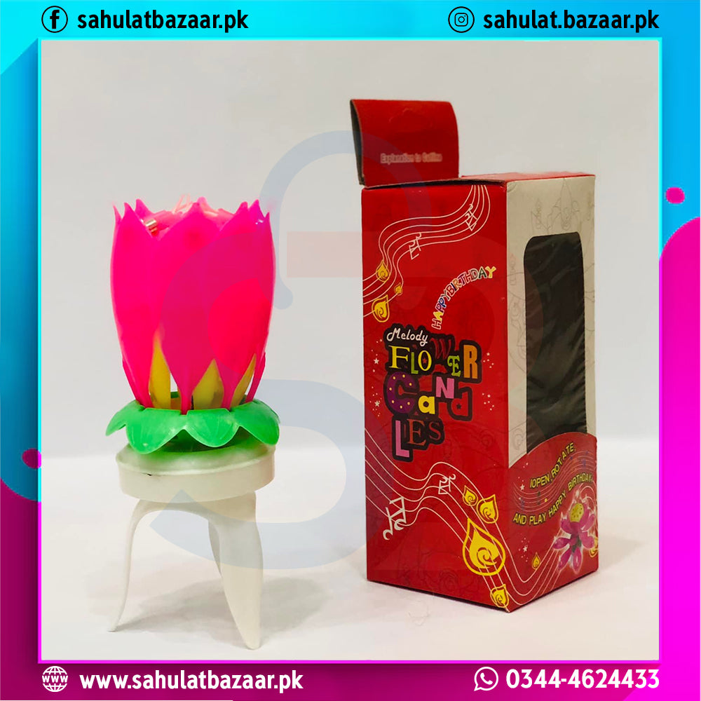 Pink flower-shaped candle on a white stand with its packaging box next to it, featuring branding text.