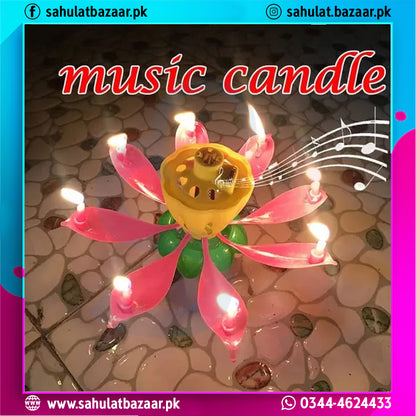 Music candle with pink and green design on a textured surface, featuring musical notes.