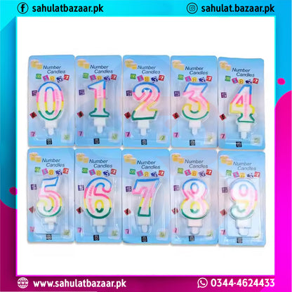 Set of colorful number candles in their packaging on a white background with brand information.