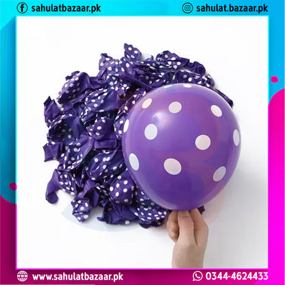 Purple balloons with white polka dots and ribbons on a white background, with a hand holding one balloon.