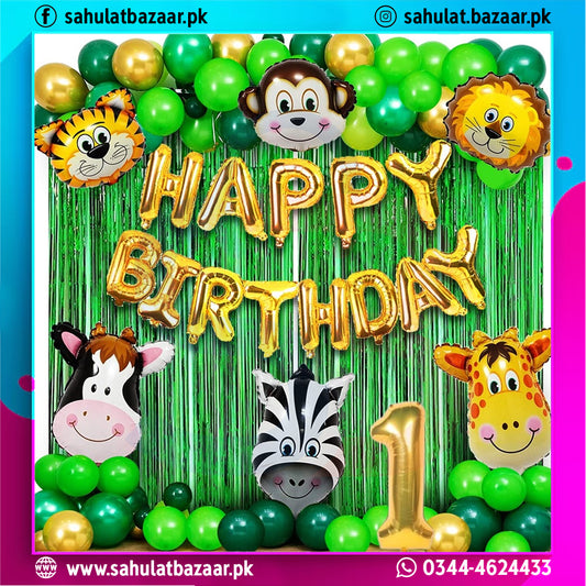 Birthday decoration with animal-themed balloons and 'Happy Birthday' text against a green curtain.