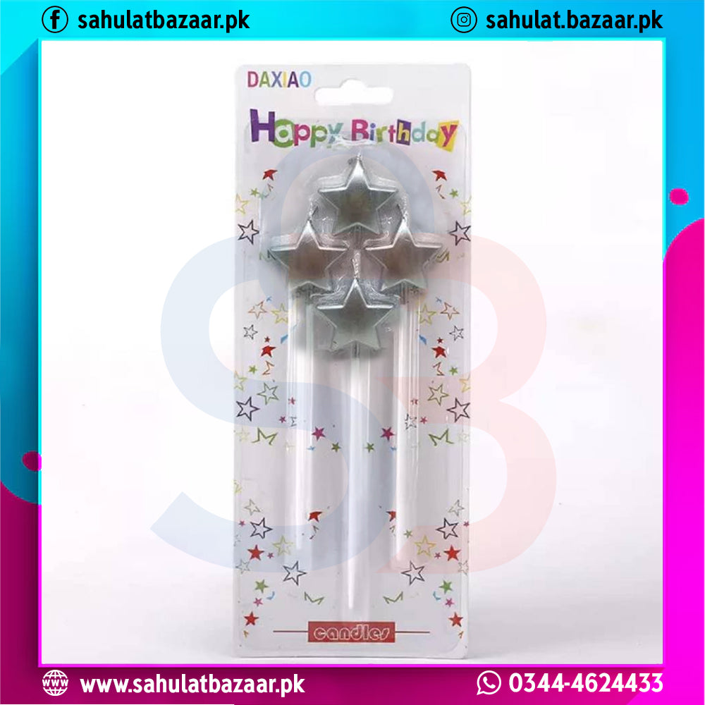 Two silver star-shaped candles in packaging with 'Happy Birthday' text on a colorful border.